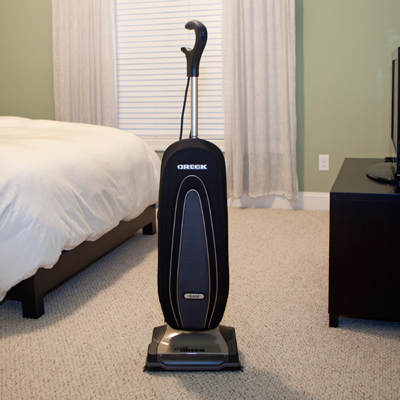 ORECK®XL Forever Gold Vacuum - Lightweight, yet powerful, this Oreck vacuum features a two-speed mower and HEPA inner bag.  Vacuum weighs 9 lbs for easy maeuverability.